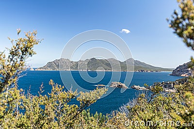 Freycinet Peninsula, Tasmania, seen through bushes at Cape Tourville Lighthouse. Stock Photo