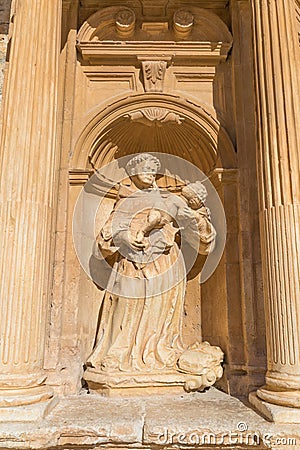 Friar with child sculpture in Penaranda de Duero Stock Photo