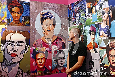 Fridamania . Young man admiring Frida Kahlo the pop icon Editorial Stock Photo