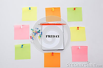 Friday, Concept write on Office table, notepad and colorful pencil. View from above with copy space Stock Photo