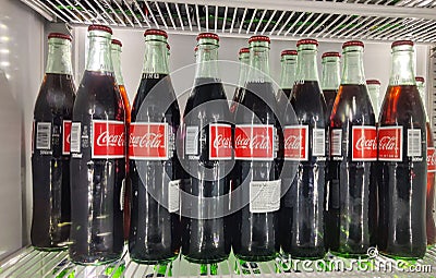 Fridge filled with coca cola bottles. Soft drink 500 ml Editorial Stock Photo