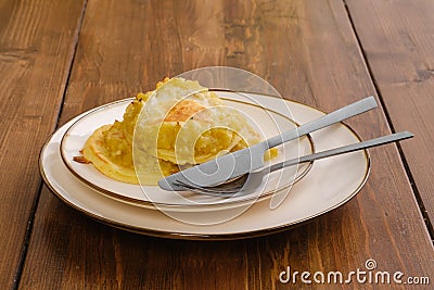 Fried apple pancakes on a plate Stock Photo