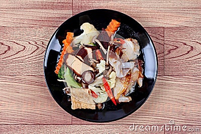 Fried big noodle topped mixed vegetables and side dish for organic food. Stock Photo