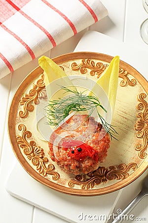 Fried burger and endive leaves Stock Photo