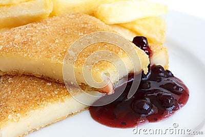 Fried cheese, cut and melting with cranberry sauce Stock Photo