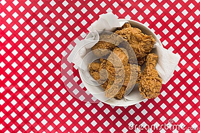 Fried Chicken basket on red and white checkered table Stock Photo