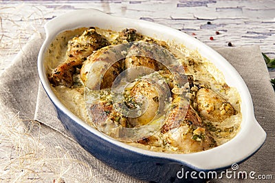 Fried chicken cooked in a creamy sauce with garlic. Stock Photo