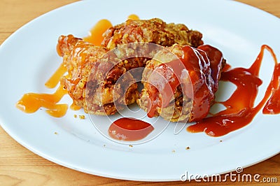 Fried chicken dressing ketchup and chili sauce on white dish Stock Photo