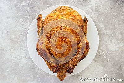 Fried chicken on a white plate. Slow cooking, farm, recipe Stock Photo