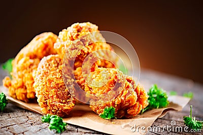 Fried chicken wings and legs on wooden table Stock Photo