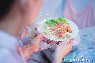 Fried Chinese sausage rice in the hands of an Asian man Stock Photo