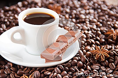 Fried coffee beans with a cup of coffee and espresso milk and anise Stock Photo