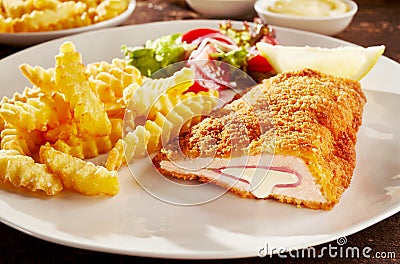 Fried cordon bleu chicken with french fries Stock Photo