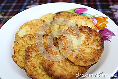 Fried cottage cheese cheesecakes in a plate Stock Photo