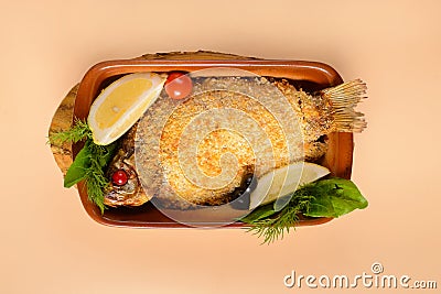 Fried crucian carp with lemon Stock Photo