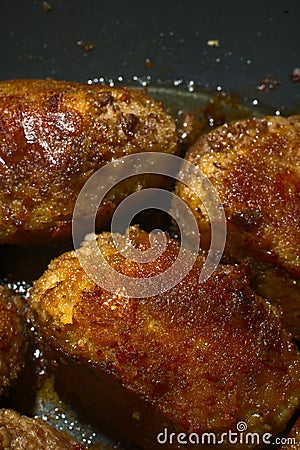 Fried cutlets in a frying pan of dark golden color. Close. Homemade Stock Photo