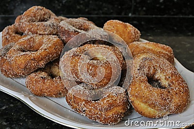 Fried donuts with sugar a typical sweet in Easter and Lent