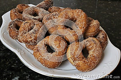 Fried donuts with sugar a typical sweet in Easter and Lent