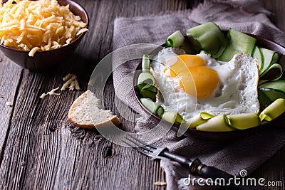 Fried egg and bread on wooden table Stock Photo