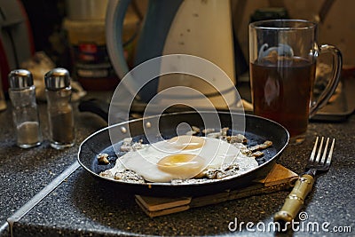 Fried egg. healthy breakfast concept. food, fresh, gourmet, healthy, kitchen, frying pan, stone table. Stock Photo
