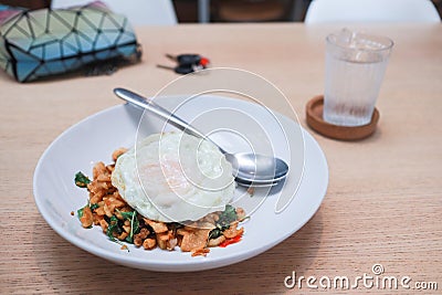Fried egg on Rice topped with stir-fried pork. Stock Photo