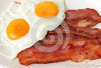 Fried eggs with bacon Stock Photo