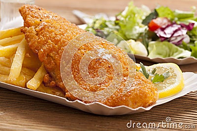 Fried fish and chips on a paper tray Stock Photo