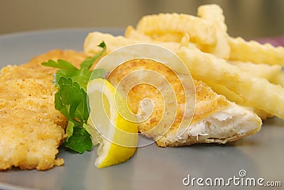 Fried fish and chips on the plate for dinner Stock Photo