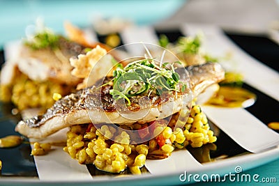 Fried Fish with Curry Risotto Stock Photo