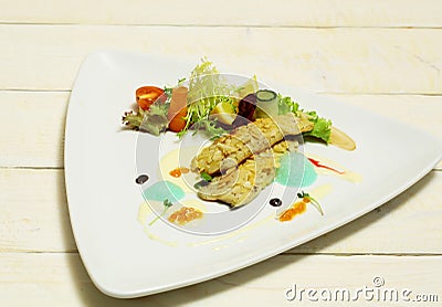 Fried fish fillet under almond Stock Photo