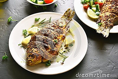 Fried fish on plate Stock Photo