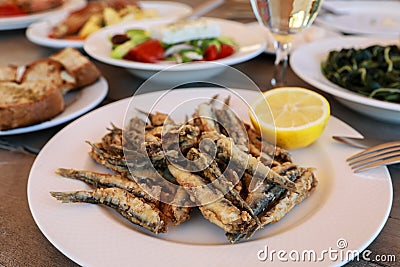 Fried fresh anchovies in the greek tavern. Stock Photo