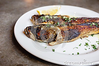 fried goby fish on plate, close-up Stock Photo