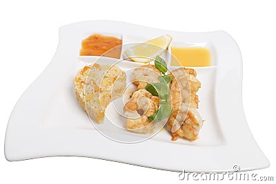 Fried large shrimps with different sauces and basil Stock Photo