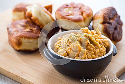 Fried Lenten pies filled with cooked peas inside, on a wooden table. Stock Photo