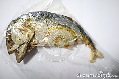 Fried mackerel in a clear plastic bag Stock Photo