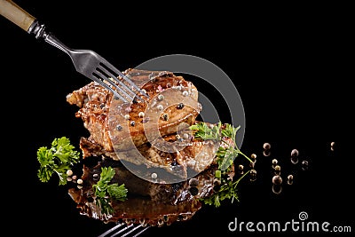 Fried meat on the fork with pepper Stock Photo