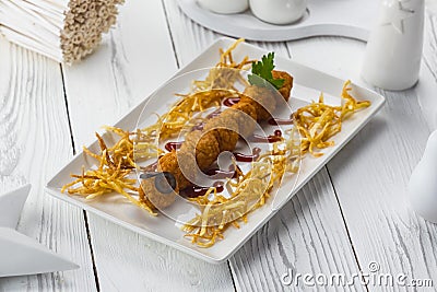 Fried meatballs with olives on a plate Stock Photo