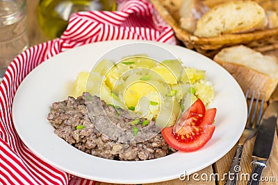 Fried minced beef in white creamy sauce in German style Stock Photo