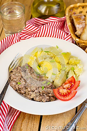 Fried minced beef in white creamy sauce in German style Stock Photo