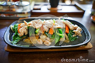 Fried noodle topped with pork Stock Photo