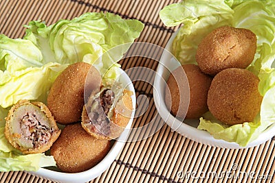 Fried olives in white bowls Stock Photo