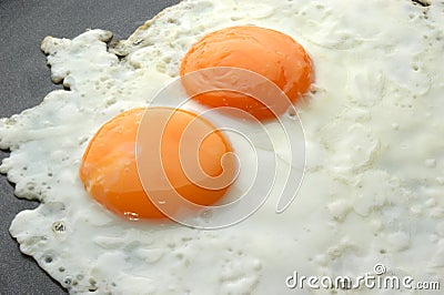 fried organic eggs in a pan Stock Photo