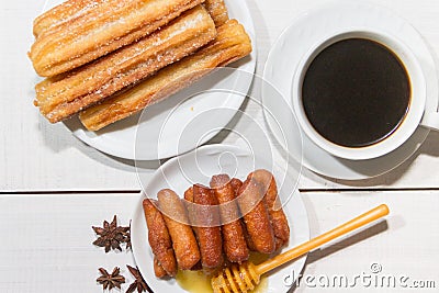 fried pestinos with honey and anise. Andalusian gastronomy Stock Photo