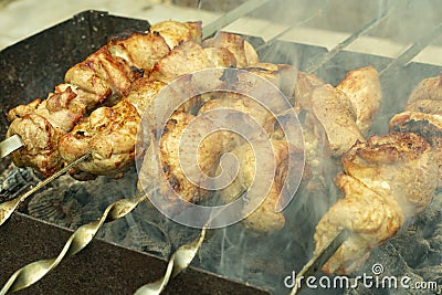 Fried pork meat, shish kebabs, cooked on charcoal grill Stock Photo