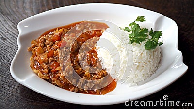 Fried pork with tomato sauce. Eggs bomb,cooking Thai Food. Stock Photo