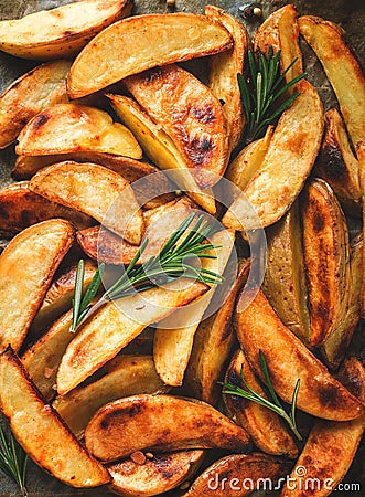 Fried potato slices , homemade , on parchment,burned , top view, close-up, Stock Photo