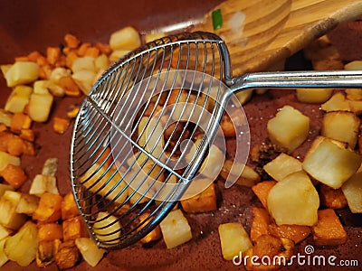 Fried potatoes - making vegetable pots Stock Photo