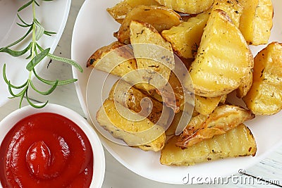 Fried potatoes on a white plate. Potato dish in a restaurant Stock Photo