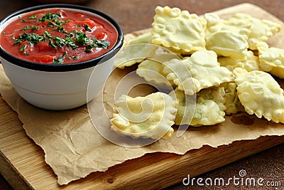 Fried ravioli and tomatoes sauce Stock Photo